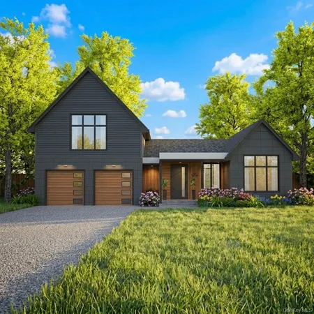 a front view of house with yard and green space