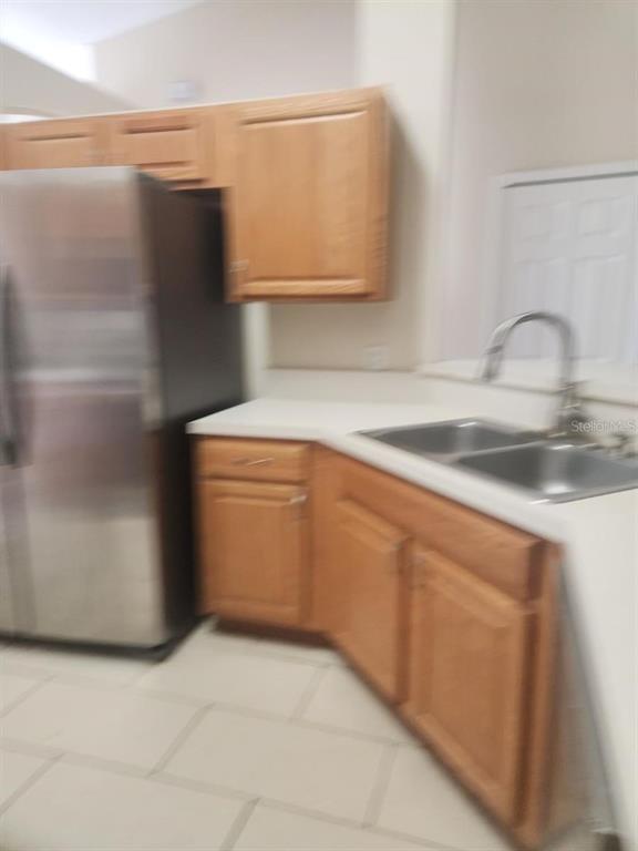 11608 Southwest 50th Circle Ocala, FL 34476 - Photo 7 of 7 a utility room with cabinets washer and dryer