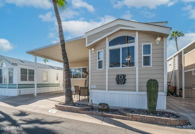 a front view of a house with garage