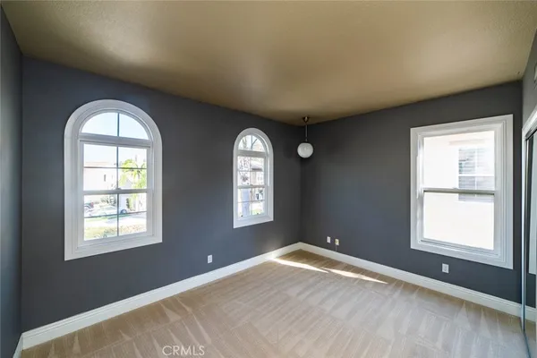 a view of empty room with windows