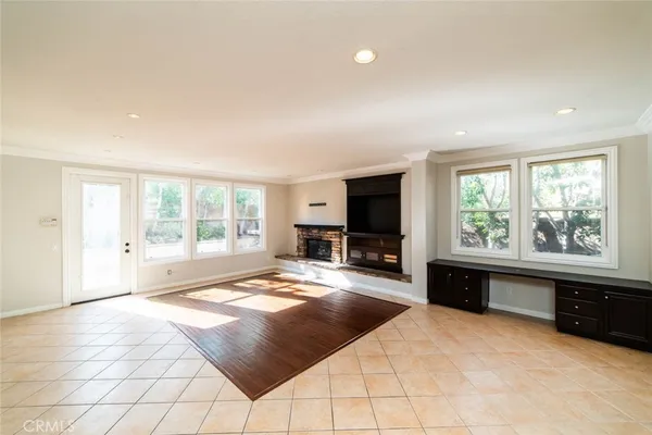 a spacious bedroom with a large bed and a flat screen tv