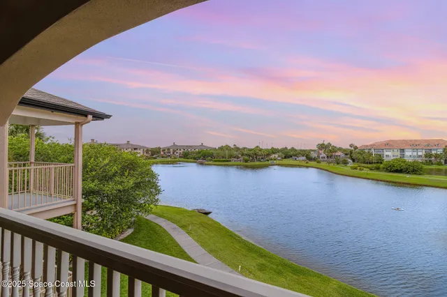 a view of room with window and wooden floor