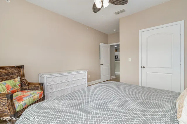 an aerial view of residential houses with outdoor space and lake view