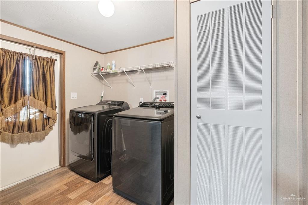 1415 Spear Street Weslaco, TX 78596 - Photo 14 of 14 a utility room with closet