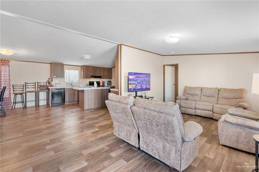1415 Spear Street Weslaco, TX 78596 - Photo 8 of 14 a living room with furniture and a wooden floor