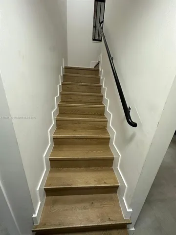 a bedroom with a bed and a lamp