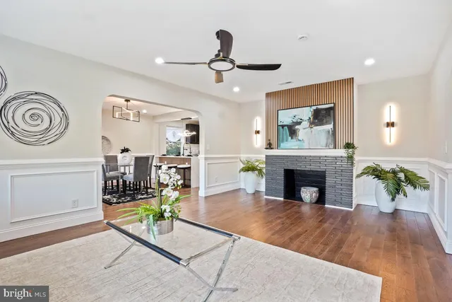 a kitchen with stainless steel appliances granite countertop a sink and a refrigerator