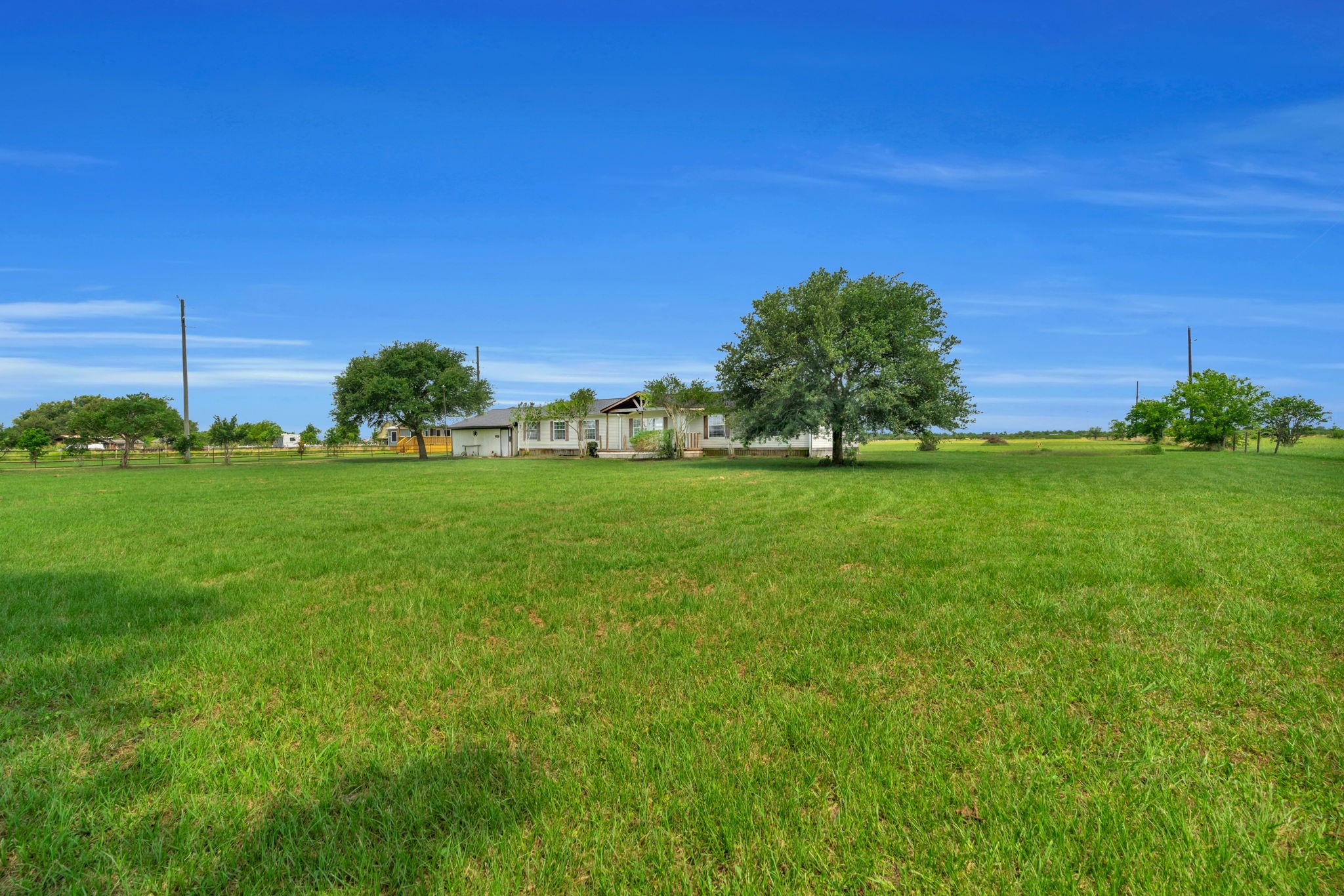 37038 Bell Road Waller, TX 77484 - Photo 29 of 33 a view of a garden with a building in the background