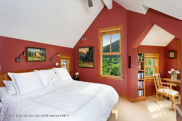 216 Curtis Lane Basalt, CO 81621 - Photo 11 of 32 a bedroom with a large bed and a large window