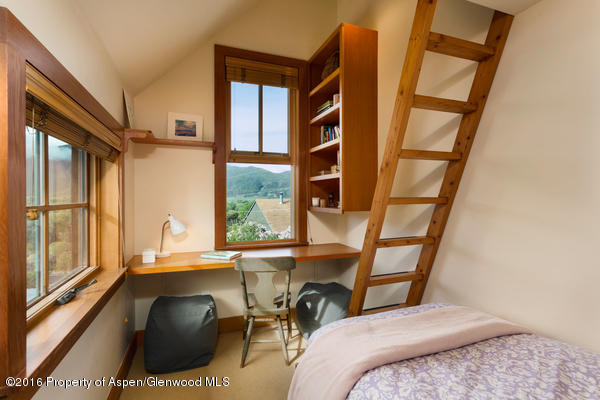 216 Curtis Lane Basalt, CO 81621 - Photo 15 of 32 a bedroom with a bed and a large window