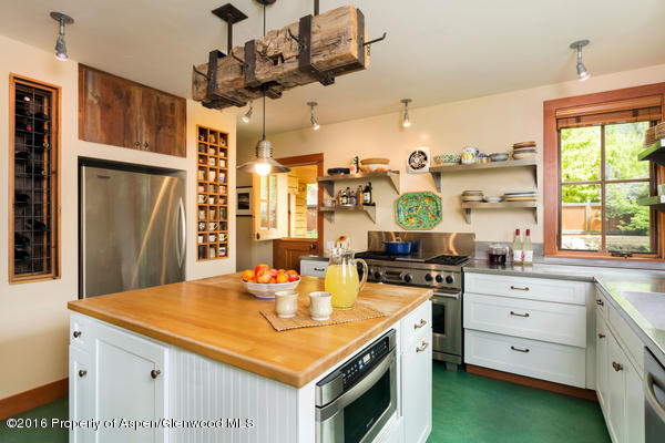 216 Curtis Lane Basalt, CO 81621 - Photo 22 of 32 a kitchen with a stove a sink a refrigerator and a window