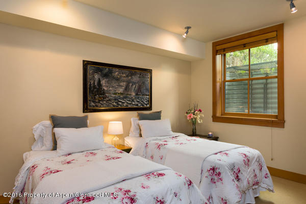 216 Curtis Lane Basalt, CO 81621 - Photo 27 of 32 a bedroom with a bed and a window