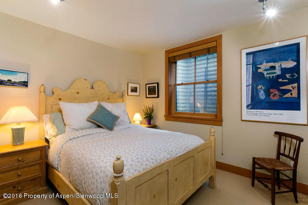 216 Curtis Lane Basalt, CO 81621 - Photo 28 of 32 a bedroom with a bed and a window