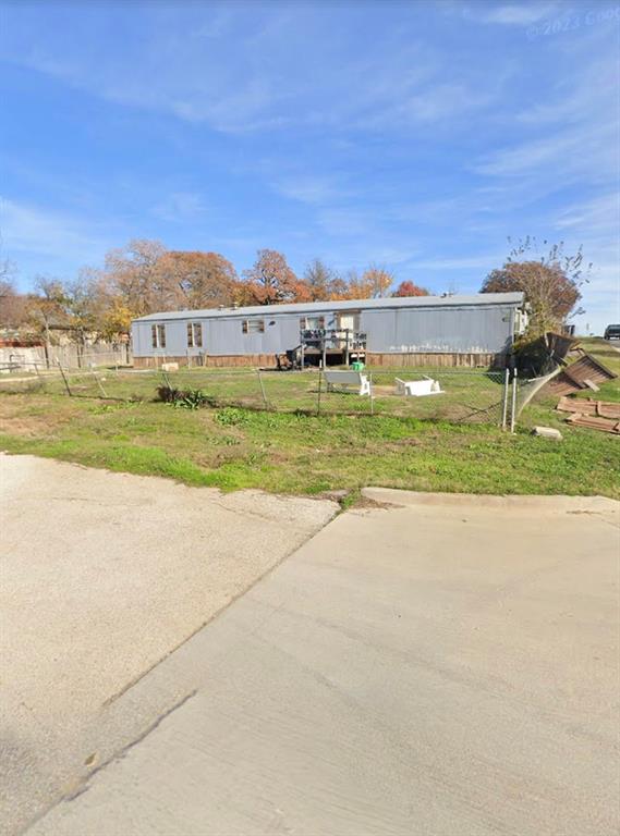 6605 Oak Ridge Lane Argyle, TX 76226 - Photo 3 of 4 a view of a big yard with an buildings in the background