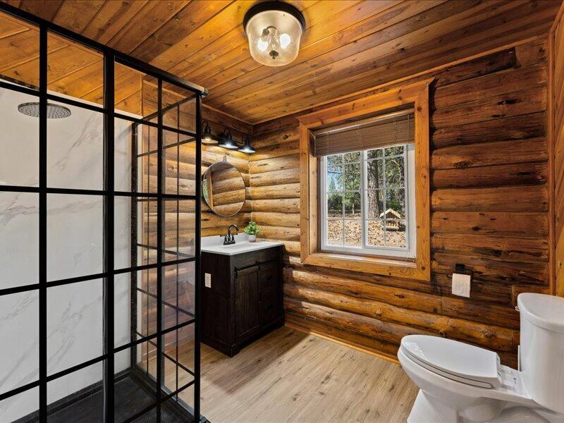 40060 Incline Drive Chiloquin, OR 97624 - Photo 14 of 26 a bathroom with a toilet a sink and a large window