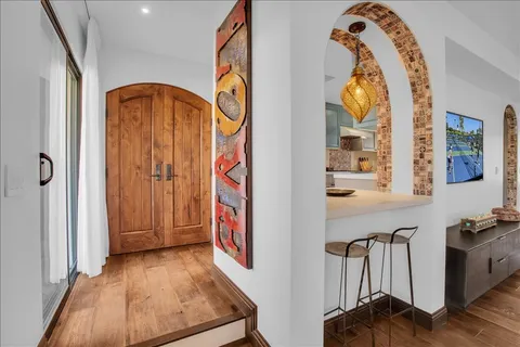 a view of swimming pool with outdoor seating and city view