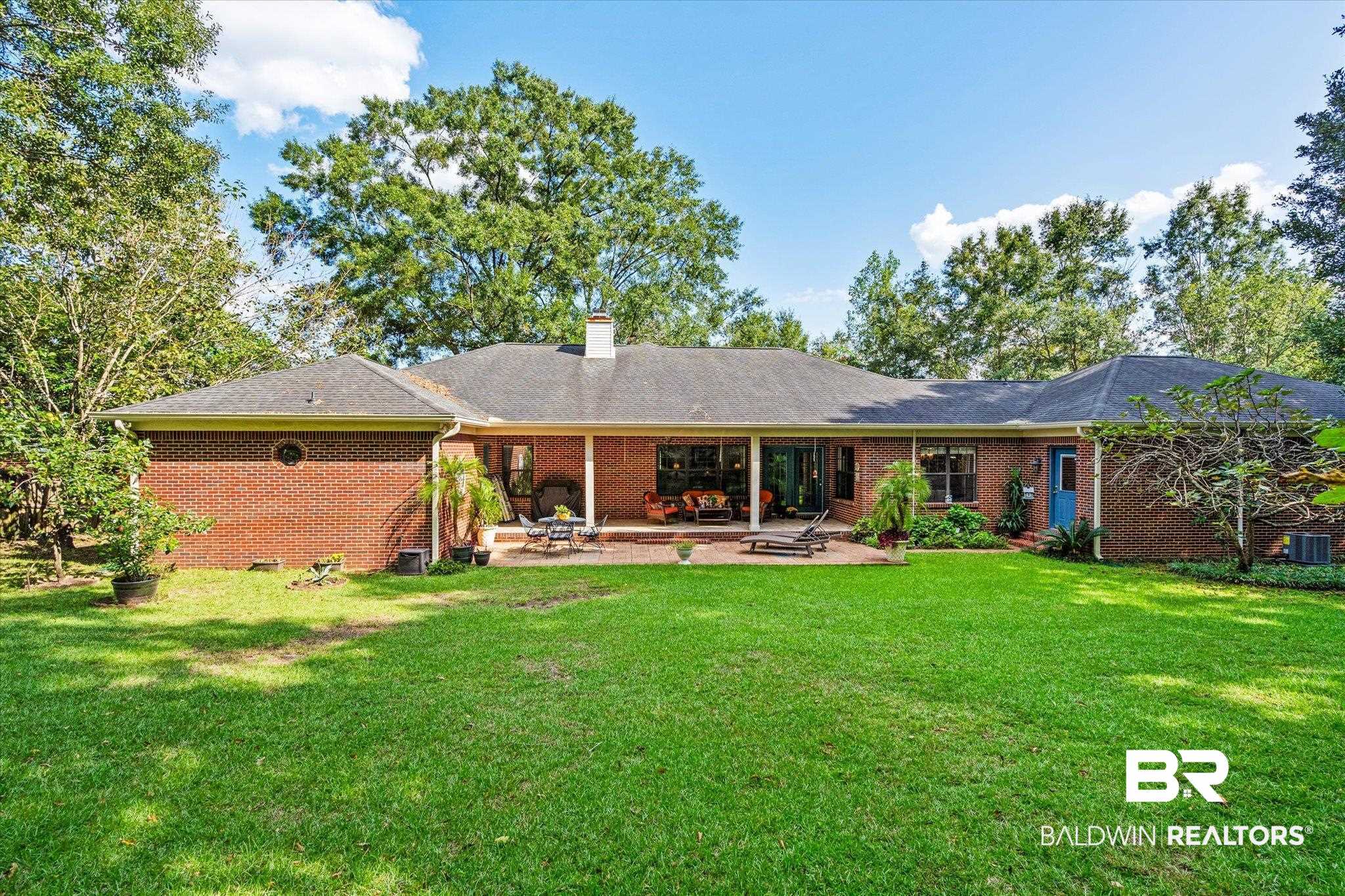 7360 Bridgewood Court Mobile, AL 36695 - Photo 28 of 30 Rear view of house featuring a patio, a lawn, and central AC unit