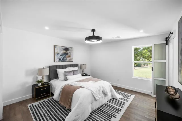 a bedroom with a bed and a dresser