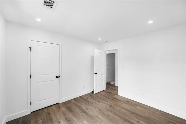 a bathroom with a toilet tub and shower