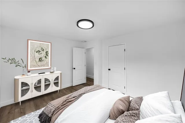 an aerial view of residential house with outdoor space and trees all around