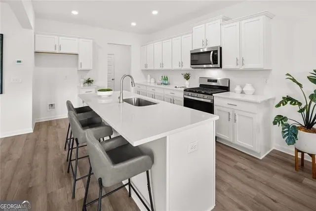 a kitchen with a table and chairs