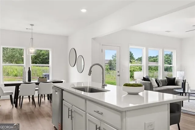 a view of entryway and hall with wooden floor