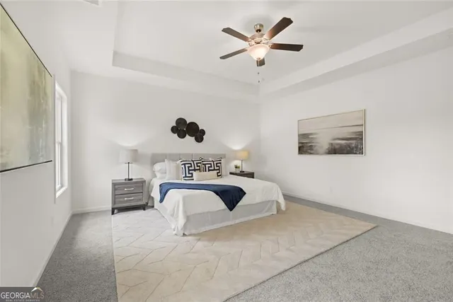 a view of a livingroom with furniture and a window
