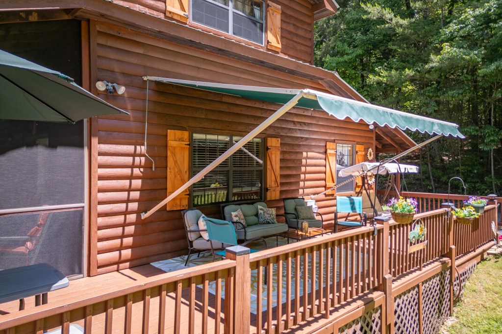 66 Fortenberry Road Young Harris, GA 30582 - Photo 41 of 55 a balcony of a house with wooden floor and outdoor seating