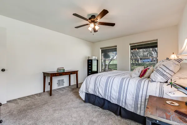 a bed room with a bed and dresser