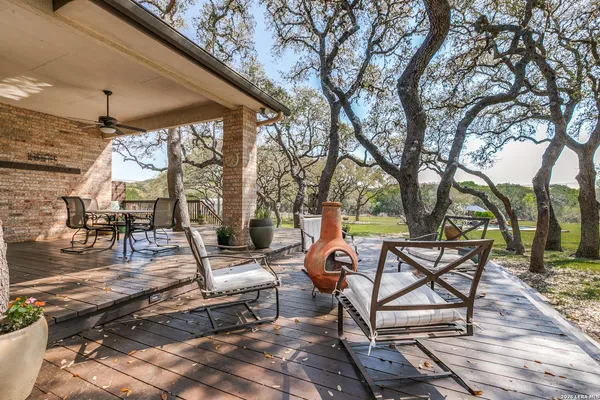 a building outdoor space with patio furniture and wooden floor
