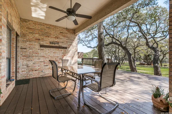 a view of a patio with a table and chairs