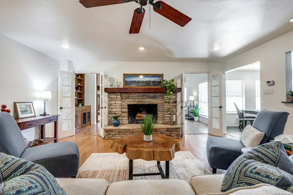 a living room with furniture and a fireplace