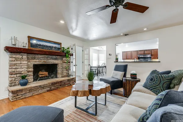 a living room with furniture and a fireplace