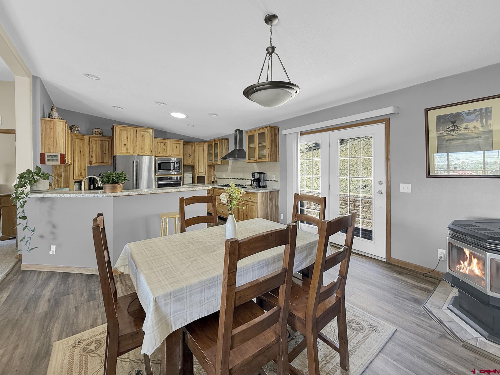 40331 D Road Crawford, CO 81415 - Photo 18 of 45 a view of a dining room with furniture window and wooden floor
