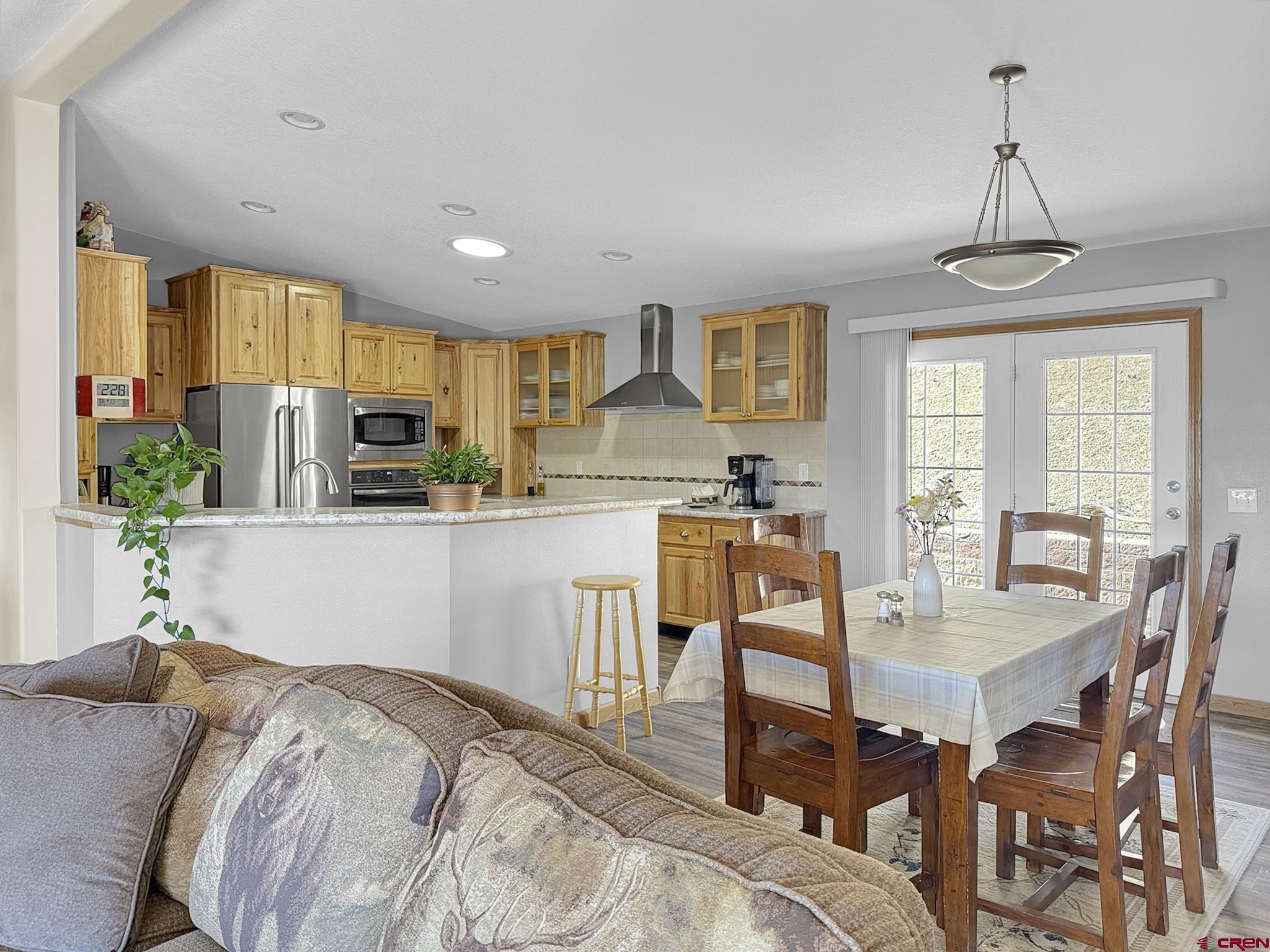 40331 D Road Crawford, CO 81415 - Photo 20 of 45 a living room with stainless steel appliances kitchen island granite countertop furniture and a kitchen view