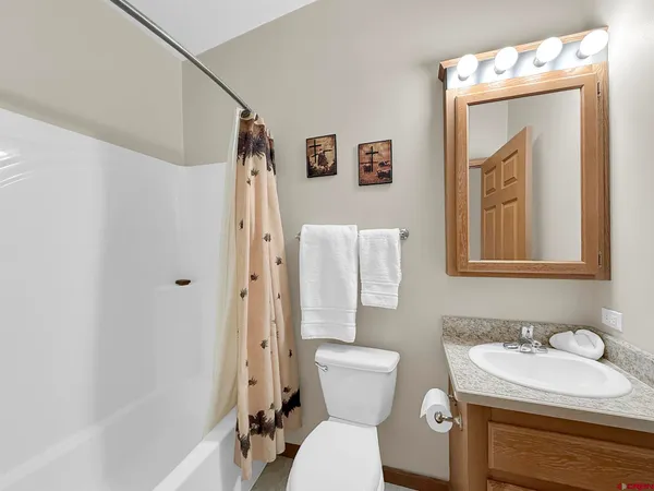 a bedroom with a bed and a cabinets
