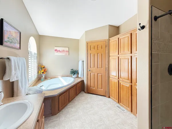 a bathroom with a sink toilet and a mirror