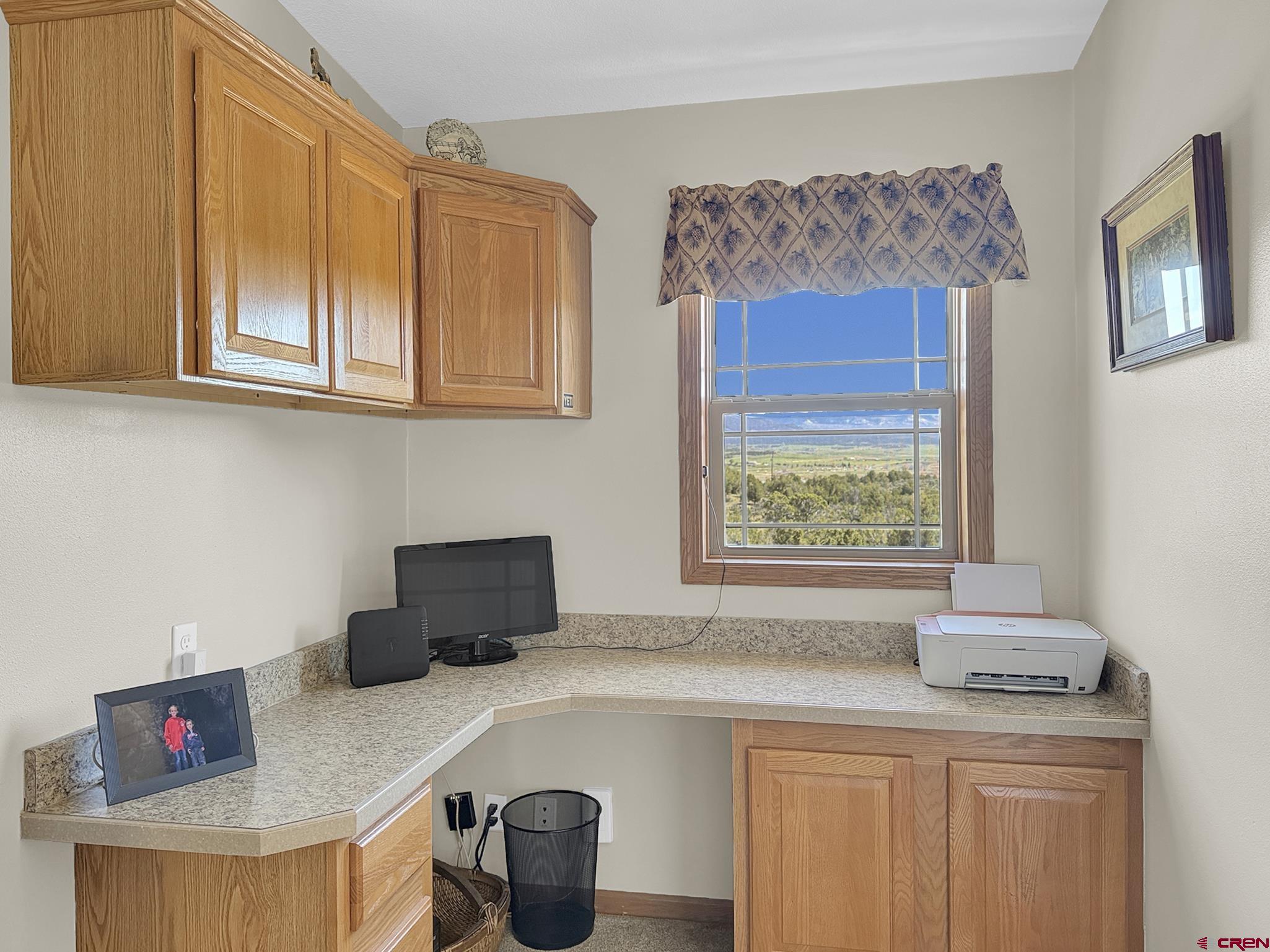 40331 D Road Crawford, CO 81415 - Photo 34 of 45 a kitchen with stainless steel appliances granite countertop a sink a stove and a wooden cabinets