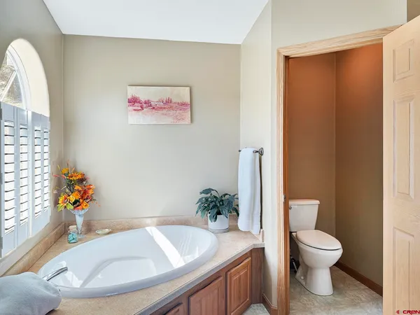 a view of a bathroom with sink and shower