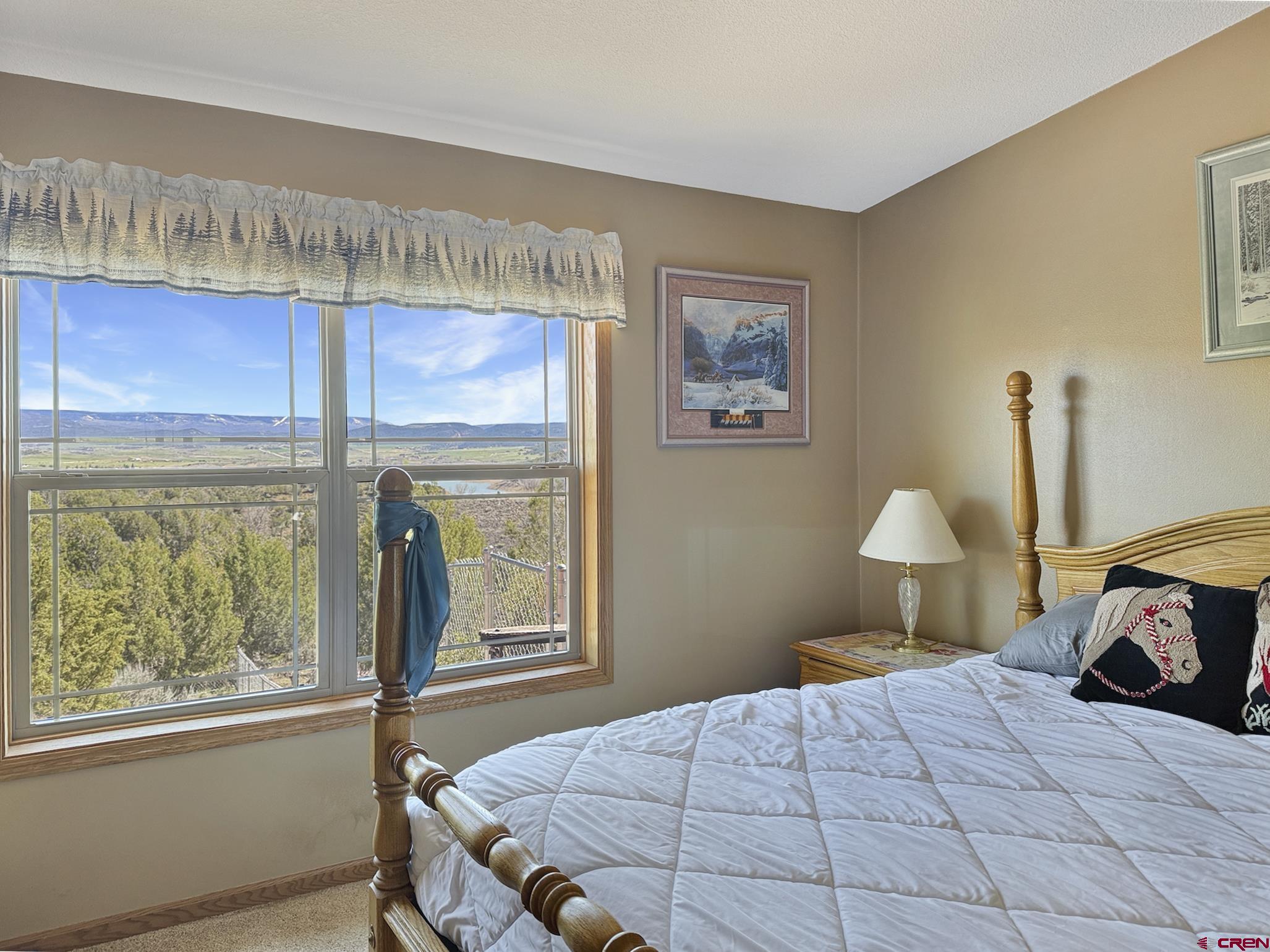 40331 D Road Crawford, CO 81415 - Photo 37 of 45 a bedroom with a bed and a painting on the wall