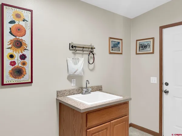 a spacious bathroom with a granite countertop tub sink and mirror
