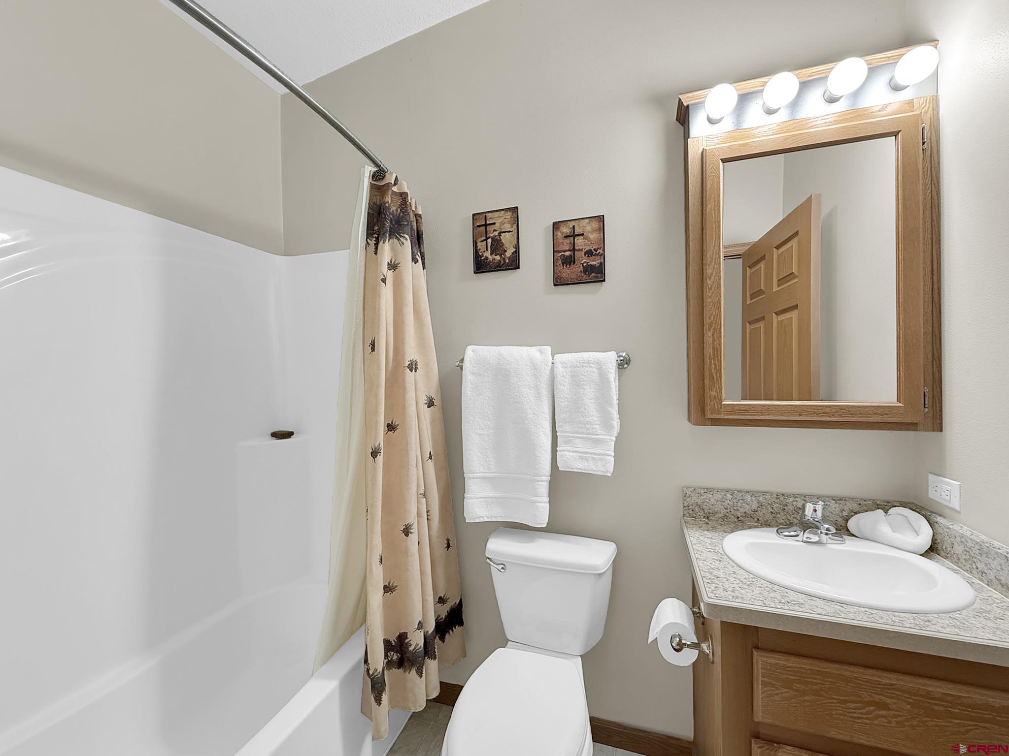 40331 D Road Crawford, CO 81415 - Photo 43 of 45 a bathroom with a toilet sink and a mirror