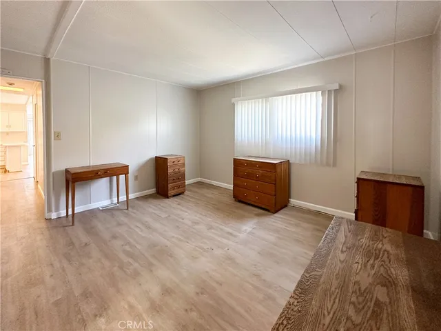a view of room with furniture and wooden floor