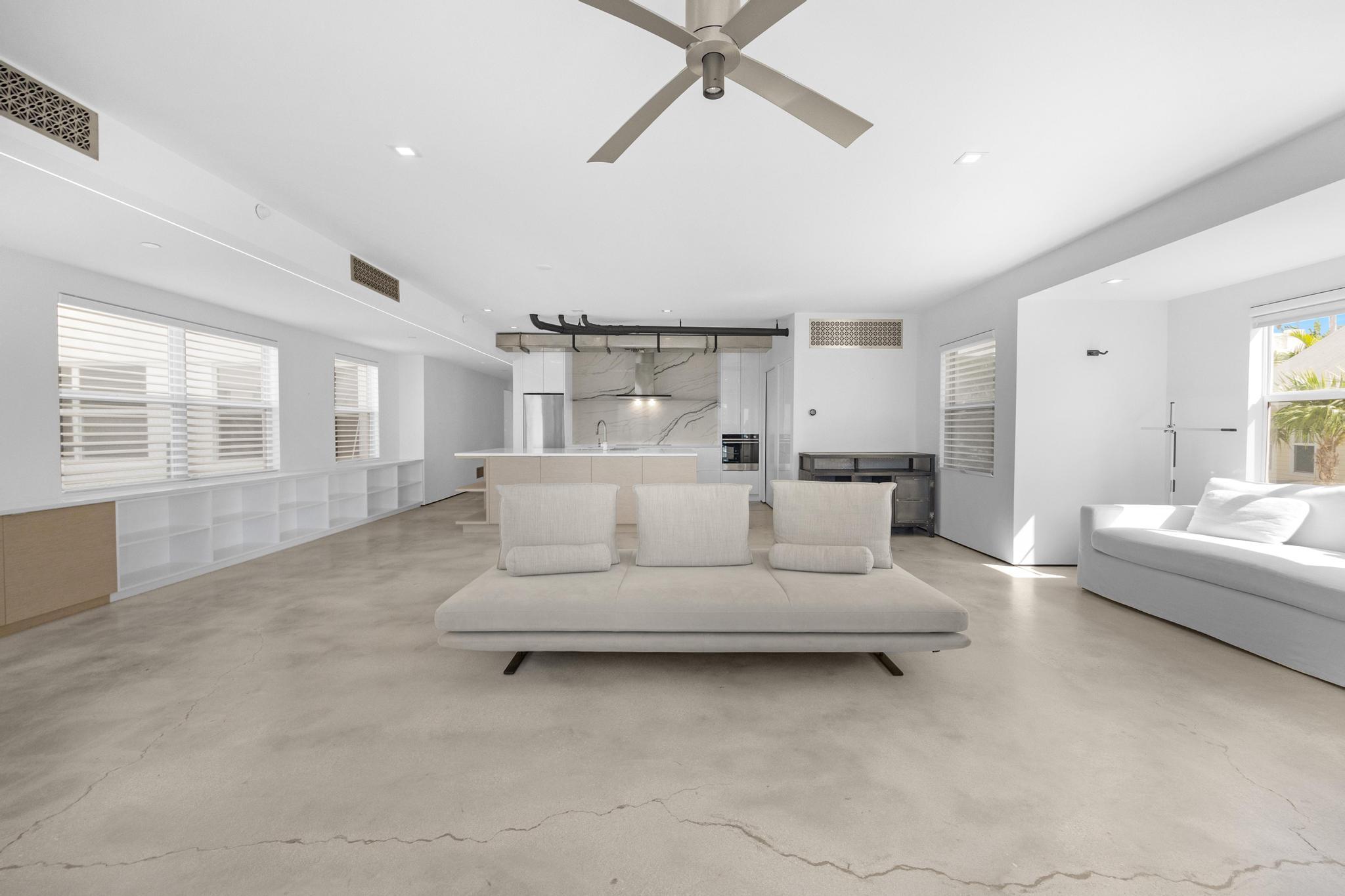 105 Front Street, Unit 122 Key West, FL 33040 - Photo 11 of 52 a living room with furniture and a large window