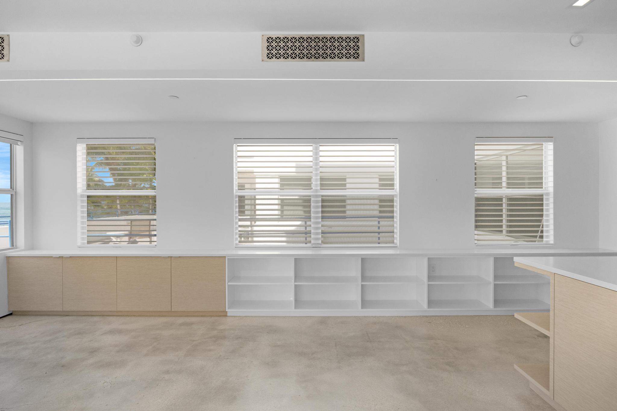 105 Front Street, Unit 122 Key West, FL 33040 - Photo 14 of 52 an empty room with windows