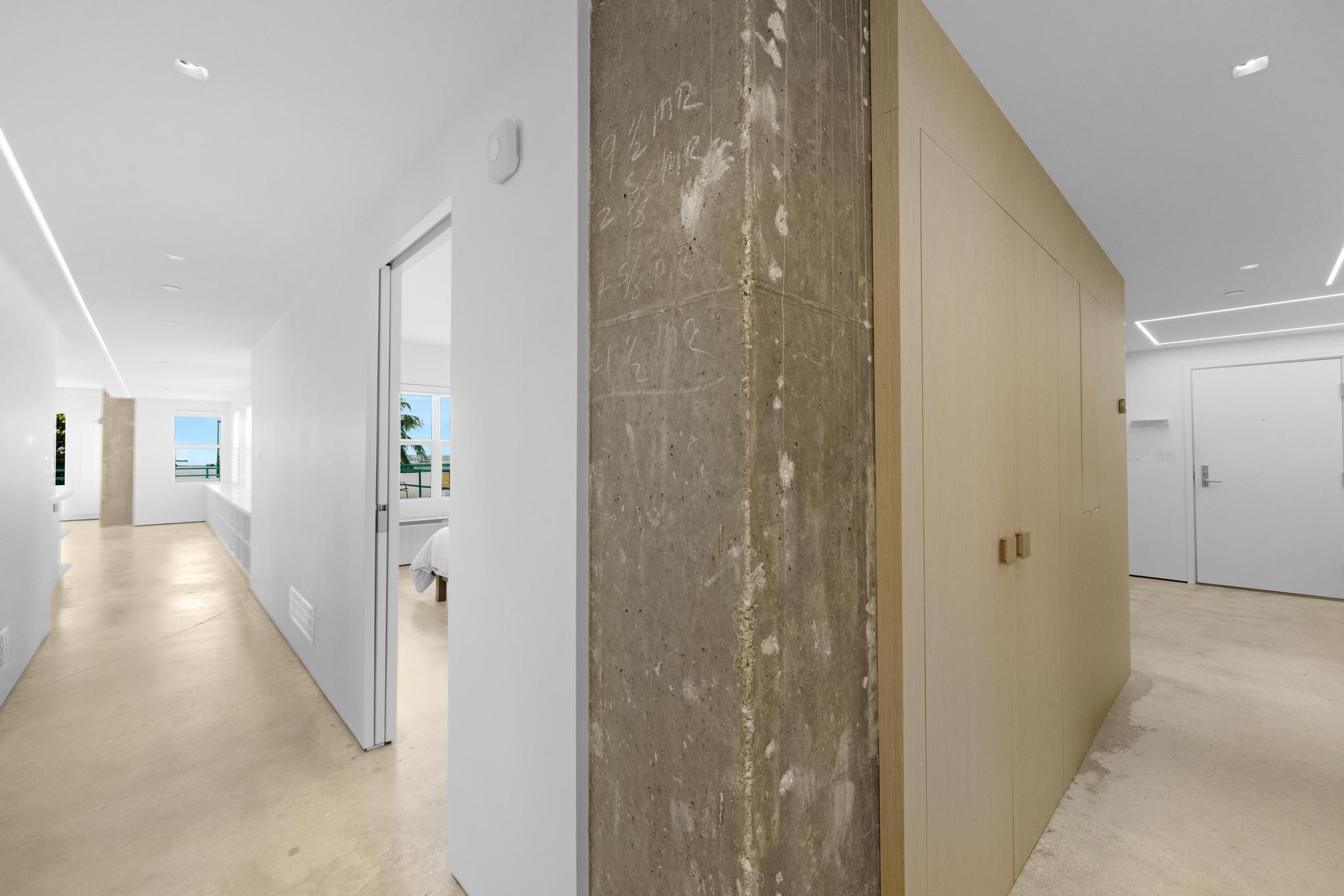 105 Front Street, Unit 122 Key West, FL 33040 - Photo 18 of 52 a view of a hallway with wooden floor