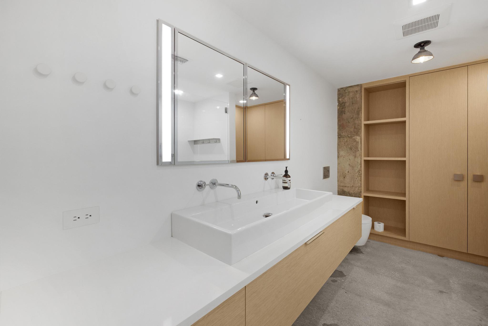 105 Front Street, Unit 122 Key West, FL 33040 - Photo 23 of 52 a bathroom with a sink and a bathtub