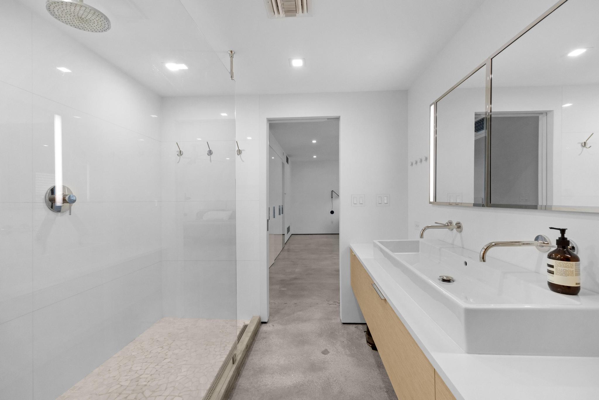 105 Front Street, Unit 122 Key West, FL 33040 - Photo 25 of 52 a bathroom with a bathtub and a sink