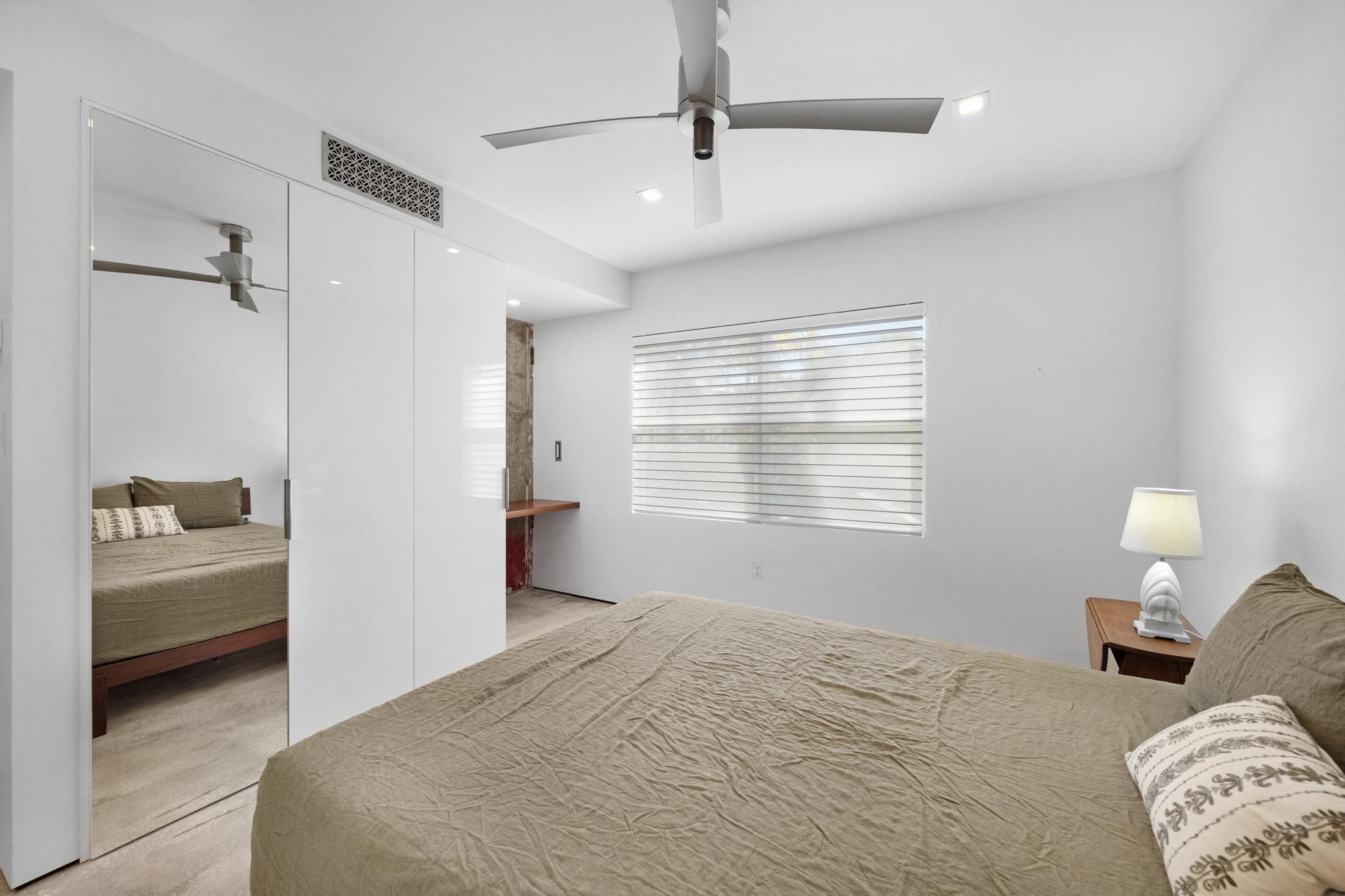 105 Front Street, Unit 122 Key West, FL 33040 - Photo 32 of 52 a bedroom with a bed and a view of bedroom