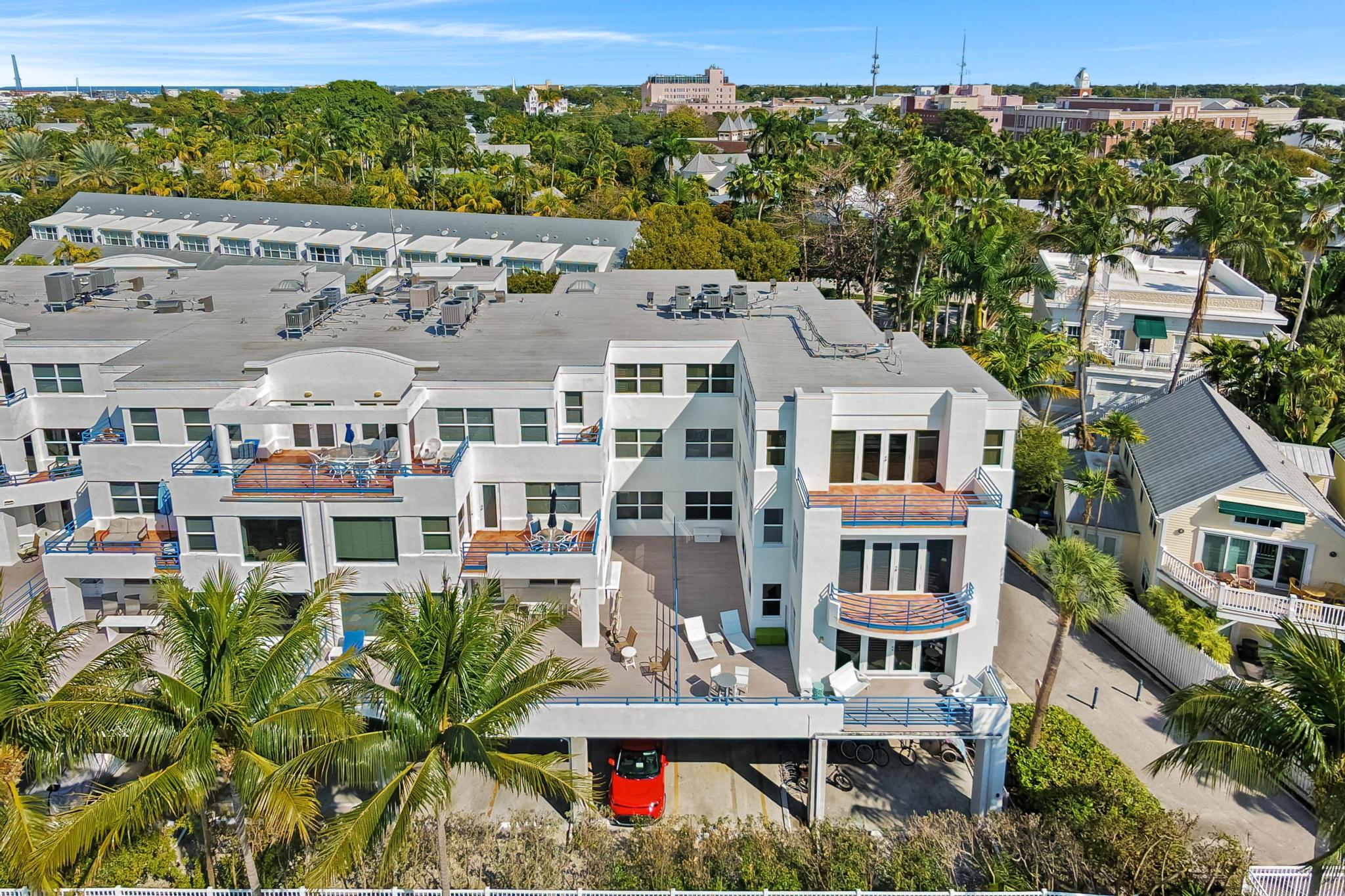 105 Front Street, Unit 122 Key West, FL 33040 - Photo 48 of 52 an aerial view of multiple houses with a yard
